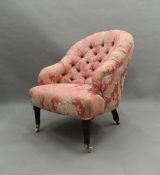 A Victorian pink florally upholstered button tub armchair. 63 cm wide.