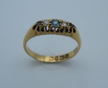 An 18 ct gold diamond and sapphire five stone ring