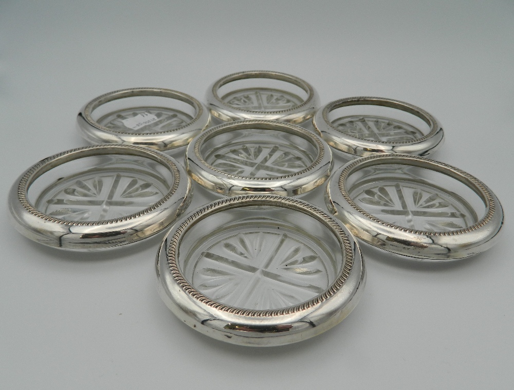 Seven glass and sterling silver rimmed coasters, stamped sterling. Each 9.5 cm diameter. - Image 2 of 4