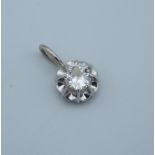 A 9 ct white gold and diamond pendant