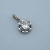 A 9 ct white gold and diamond pendant