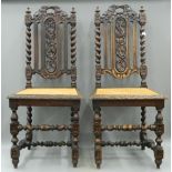 A pair of 19th century carved oak cane seated chairs