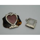 An unusual hallmarked silver heart shaped frame forming part of a tortoiseshell backed letter clip,