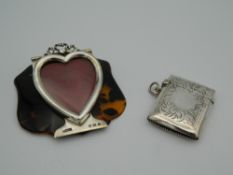An unusual hallmarked silver heart shaped frame forming part of a tortoiseshell backed letter clip,