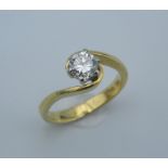 An 18 ct gold 1/2 carat diamond solitaire ring.