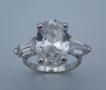 A silver and cubic zirconia ring.