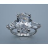 A silver and cubic zirconia ring.