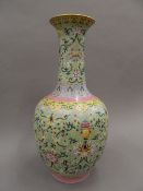 A Chinese porcelain green ground bottle vase, the underside with blue painted six character mark.