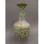 A Chinese porcelain green ground bottle vase, the underside with blue painted six character mark.