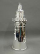 A silver plate cocktail shaker formed as a lighthouse. 35 cm high.