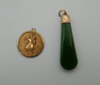 An Edwardian engraved rose gold and jade pendant, together with a St. Christopher pendant.