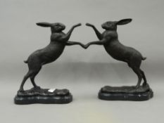 A pair of bronze boxing hares. Each 29 cm high.