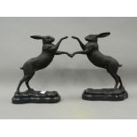 A pair of bronze boxing hares. Each 29 cm high.