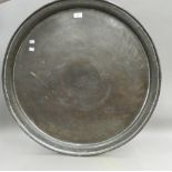 A large copper tray. 77 cm diameter.