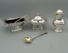 A substantial three piece silver cruet set consisting of a mustard cruet, 10 cm wide,