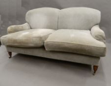 A Howard style upholstered settee. 165 cm wide.