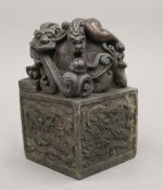 A large Chinese bronze dragon seal. 13 cm high.