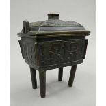 A 19th century Chinese bronze incense burner and cover in the archaic style,