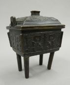 A 19th century Chinese bronze incense burner and cover in the archaic style,