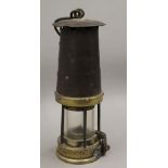 A vintage miners lamp. 27 cm high.
