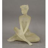 A model of a seated dancer. 18 cm high.