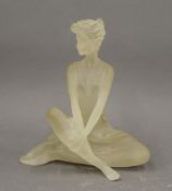 A model of a seated dancer. 18 cm high.