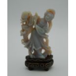 A Chinese carved stone figure of Guanyin, on stand. 6.5 cm high excluding stand.