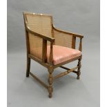 An early 20th century bergere armchair. 52 cm wide.