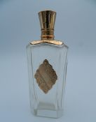 An 18 ct gold topped scent bottle. 8.75 cm high.