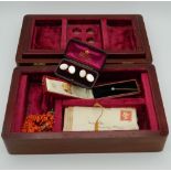 A jewellery box containing various jewellery, etc.