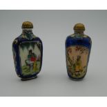 Two Chinese snuff bottles. The largest 6.5 cm high.