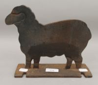 A cast iron doorstop formed as a sheep. 22.5 cm long.