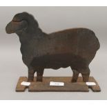 A cast iron doorstop formed as a sheep. 22.5 cm long.