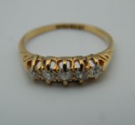 An 18 ct gold five stone diamond ring.