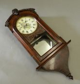 A 19th century Bisto advertising walnut cased drop dial wall clock. 89 cm high.