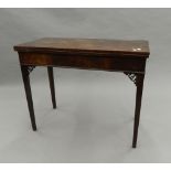 A 19th century mahogany folding tea table. 90 cm wide.