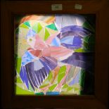 A stained glass panel depicting a bird, framed. 39.5 cm wide.