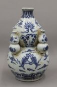 A Chinese blue and white porcelain double gourd vase. 26.5 cm high.