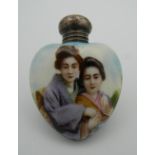 An early 20th century silver mounted heart shaped porcelain scent bottle. 5.5 cm high.