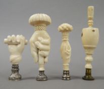 Three 19th century ivory seals and a bone seal. The tallest 12 cm high.