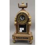 A 19th century French gilt mantle clock, set with Sevres style porcelain panels. 38 cm high.
