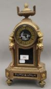 A 19th century French gilt mantle clock, set with Sevres style porcelain panels. 38 cm high.