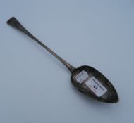 A Georgian silver stuffing spoon. 29 cm long (2.6 troy ounces).