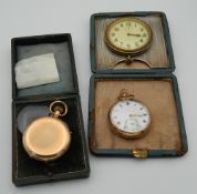 Two gold plated pocket watches and a travelling clock set in a silver frame. The latter 9 cm wide.