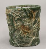 A Chinese carved jade brush pot, the reverse signed. 15.5 cm high.