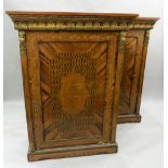 A pair of 19th century ormolu mounted parquetry pier cabinets. Each 95 cm wide, 131 cm high.