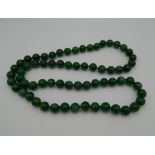 A jade bead necklace. 80 cm long.
