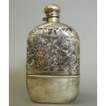 A sterling silver mounted spirit flask. 17 cm high.