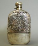 A sterling silver mounted spirit flask. 17 cm high.