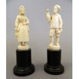 A pair of 19th century Dieppe carved ivory figures. Each 13 cm high including base.